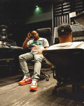 Supreme Grey Group T Shirt worn by Yo Gotti on the Instagram account @yogotti1_fans