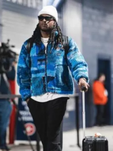 Rimowa Black Front Sleeve Cabin Suitcase worn by Davante Adams on the Instagram account @blitzfits