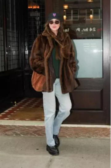The Row Bindle Shoulder Bag worn by Dakota Johnson in New York City on October 14, 2024