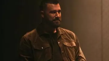 Outfits of Grotesquerie TV series: Travis Kelce wears Brown Jacket to play Ed Laclan in season 1, episode 10