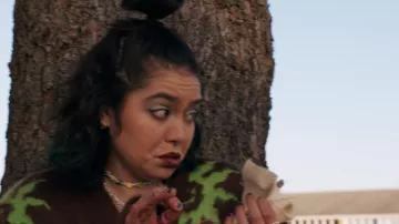Mean Girls Wardrobe: Janis 'Imi'ike (Auli'i Cravalho) wears ASOS Collusion Brown and Green Smiley Sun Jacquard Cardigan in the movie