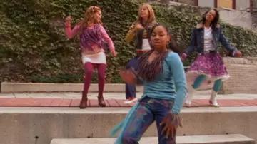 The Cheetah Girls Outfits: Galleria (Raven-Symoné) is wearing Versace Jeans Couture Paint Splatter Jeans in the movie