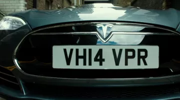 The Tesla Model S of Sacha Baron Cohen and Mark Strong in The Brothers Grimsby