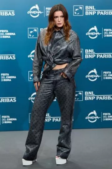 Marine Serre Moonogram Straight-Leg Trousers worn by Bella Thorne at The Trainer Photocall on October 20, 2024