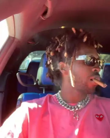 Comme des Garcons Pink Heart Logo T Shirt worn by Saint Jhn on the Instagram account @saint._.jhn