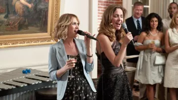 Bridesmaids Movie Outfits: Kristen Wiig wears Rebecca Taylor Black Floral Strapless Mini Dress with Pockets to portray Annie
