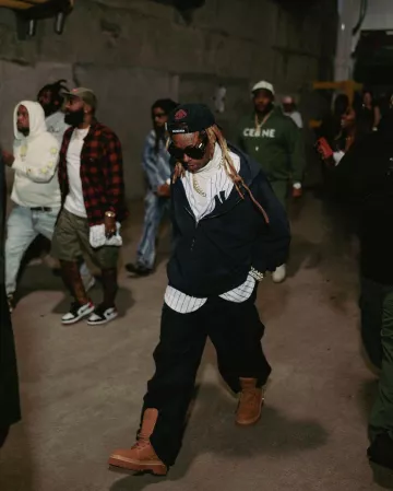 Balenciaga Black Zip-Off Flared Cargo Pants worn by Lil Wayne on the Instagram account @dayhunch