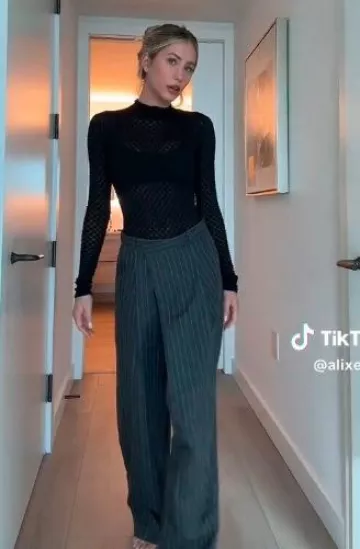 Frame Lace Mesh Turtleneck Blouse worn by Alix Earle on her  Tiktok on November 13, 2024