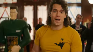 Outfits of Argylle Movie: Henry Cavill wears Spy Abstract Logo Yellow T-Shirt to play Argylle
