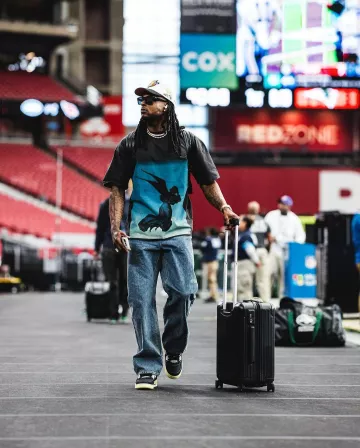 Rimowa Black Front Sleeve Cabin Suitcase worn by Davante Adams on the Instagram account @nyjets