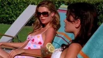 Outfits of The O.C.: Mischa Barton wears One Teaspoon Pink Hearts One Piece Swimsuit to play Marissa Cooper in season 3, episode 1