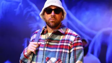 Travis Kelce wears Half-Zip Plaid Jacket arriving at Chiefs vs Panthers NFL Game on November 24, 2024