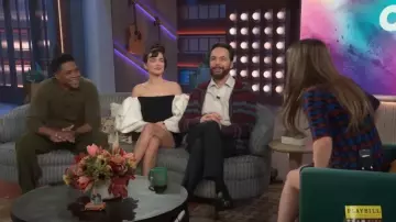 Carolina Herrera Off-Shoulder Mini Dress with Draped Bow Sleeves worn by Zoey Deutch as seen in The Kelly Clarkson Show on November 12, 2024