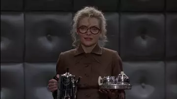 Outfits from Batman Returns: Michelle Pfeiffer wears Round Eyeglasses to play Selina Kyle in the movie