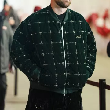 Travis Kelce wears Velvet Green Bomber Jacket arriving to the Kansas City Chiefs vs. Las Vegas Raiders game on November 29, 2024