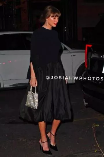 Simkhai Kenlie Long Sleeve Mock Neck Midi Dress worn by Taylor Swift in New York City on December 3, 2024