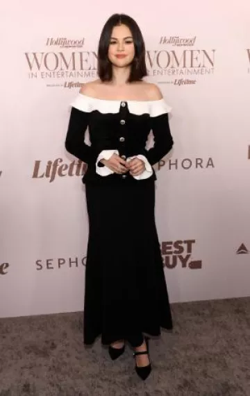 Self-Portrait Black Chenille Knit off Shoulder Midi Dress worn by Selena Gomez at The Hollywood Reporter's Women in Entertainment Gala on December 4, 2024