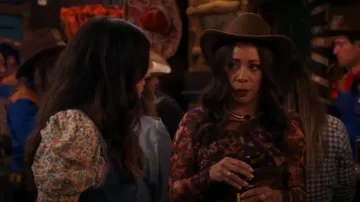 Allsaints Elia Spark Printed Mesh Long Sleeve Bodysuit In Brown worn by Rosie (Selenis Leyva) as seen in Lopez vs Lopez (S03E05)