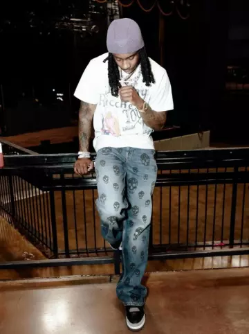 Alexander McQueen Blue Allover Skull Baggy Jeans worn by Polo G on the Instagram account @polo.capalot