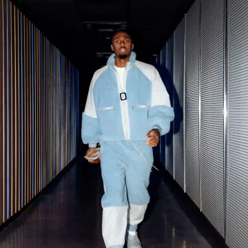 JW Anderson Light Blue Sherpa Fleece Jacket worn by Tyrese Maxey on the Instagram account @sixers