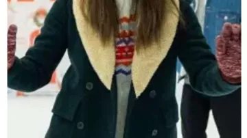 Outfits of Happiest Season: Jane (Mary Holland) wears Green Shearling Peacoat