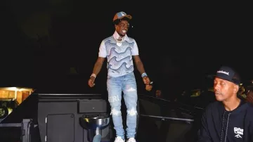 Amiri Perfect Indigo & White Boucle Logo Jeans worn by Kodak Black in Kodak Black - News Matt [Official Video]