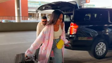 Chanel Lambskin Quilted Mini Rectangular Flap Yellow worn by Lisa Barlow as seen in The Real Housewives of Salt Lake City (S05E13)