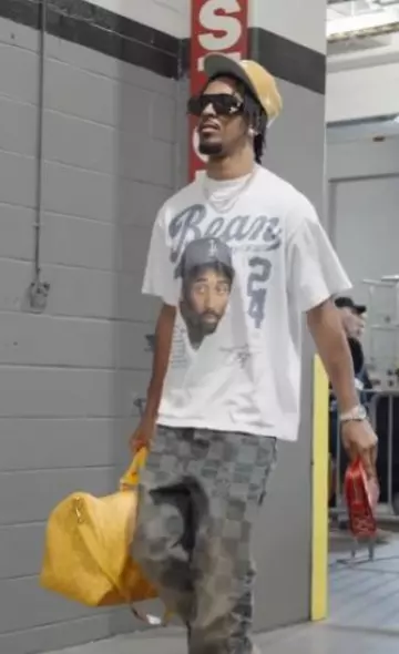 Louis Vuitton Yellow Heritage Monogram Keepall 45 Bag worn by Jayden Daniels on the Instagram account @blitzfits