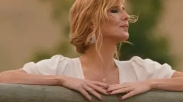 Wardrobe of Yellowstone Season 5:  Beth Dutton (Kelly Reilly) in wears White Cardigan in season 5, episode 14 of the TV series