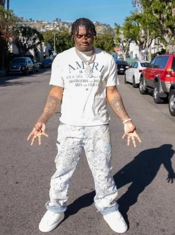 Amiri Ivory & Blue Arts District T Shirt worn by Fredo Bang on the Instagram account @fredobang