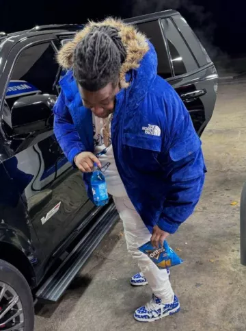 Supreme x The North Face Blue Suede Down Coat worn by Big Homiie G on the Instagram account @bighomiieg