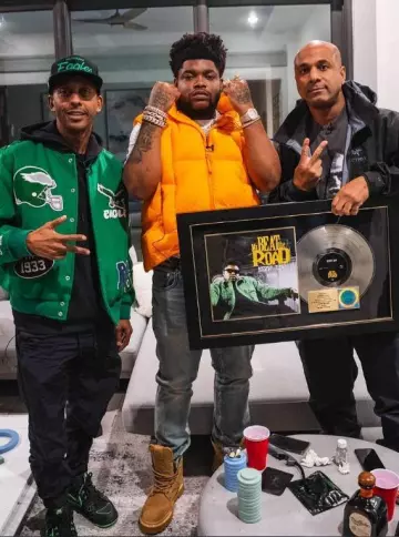 Moncler X Roc Nation Orange Apus Down Vest worn by BossMan Dlow on the Instagram account @bossman_dlow