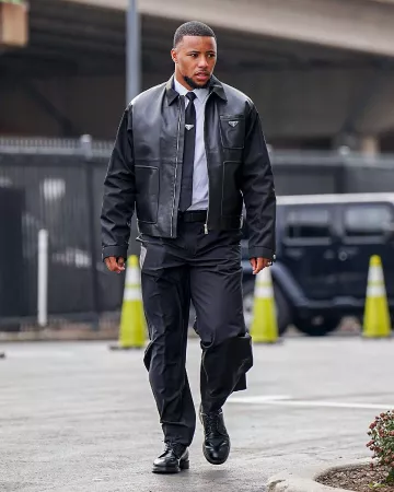 Cravate Prada Black Nylon Triangle Logo portée par Saquon Barkley sur le compte Instagram @philadelphiaeagles