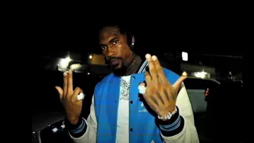 Amiri Light Blue & White 3 Stars Varsity Jacket worn by Hunxho in Finesse2Tymes - Bigger Now ft. Hunxho [Official Music Video]
