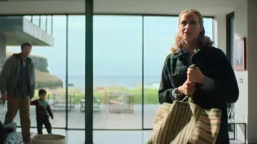 The Braided Rug Company Calypso Large Beni Bag worn by Maddie Wilson (Niamh Algar) as seen in Playing Nice (S01E01)