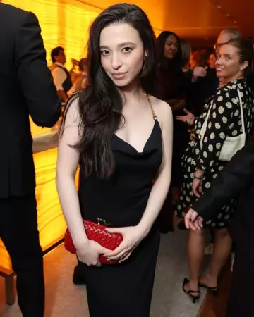 Bottega Veneta Viscose Long Dress with Chain Detail worn by Mikey Madison at Uta Hosts Annual Golden Globes Afterparty on January 5, 2025