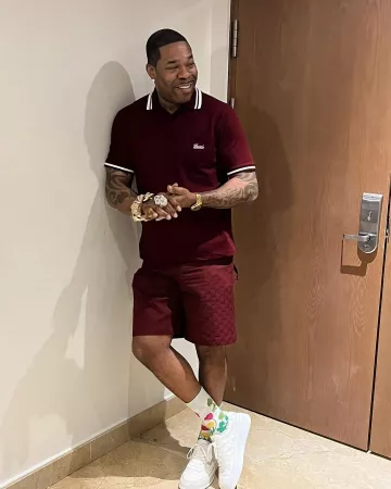 Gucci Burgundy & White-Trim Polo worn by Busta Rhymes on the Instagram account @bustarhymes