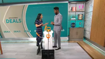 Milly Directional Plaid Asymmetrical Knit Dress worn by Elizabeth Werner as seen in CBS Mornings on January 8, 2025