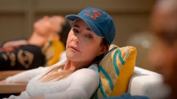 CV x Every Mother Counts Baseball Hat In Denim w/ Bright Poppy Maman Je Taime worn by Liz (Christa Miller) as seen in Shrinking (S02E12)