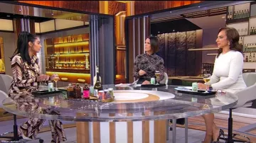 Zara High Waisted Marble Printed Flare Pants worn by Shanelle Kaul as seen in CBS Mornings on January 19, 2025