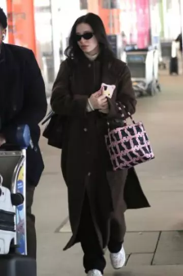 Chanel Coton Tweed Suede Calfskin & Calfskin Pink / Ecru Low Top Sneakers worn by Mikey Madison at LAX Airport on January 21, 2025
