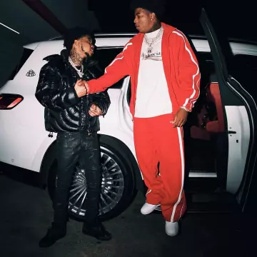 Vetements Red V-Oval Baggy Sweatpants worn by Yungeen Ace on the Instagram account @lilpoppa