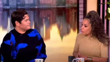 Alexander McQueen Exploded Blue Lily Jacquard Sweater worn by Harvey Guillen as seen in The View on January 29, 2025