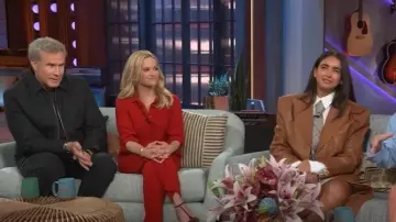 Max Mara Straight Fit Wool Satin Trousers worn by Reese Witherspoon as seen in The Kelly Clarkson Show on January 31, 2025