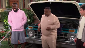 Nike Club Fleece Hoodie In Pink Foam worn by Malcolm Butler (Sheaun McKinney) as seen in The Neighborhood (S07E11)