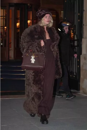 Hermes Vintage Leather Birkin Bag in Chocolate Brown worn by Elsa Hosk in Paris on January 27, 2025