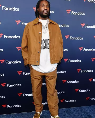 Prada Tobacco Brown Moleskin Carpenter Pants worn by Meek Mill on the Instagram account @meekmill