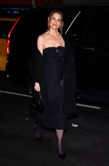 Michael Kors Collection Natalie Leather Barrel Bag worn by Katie Holmes at Michael Kors Madison Avenue Opening on February 3, 2025