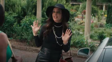 Alice + Olivia Toni Faux Leather Pleated Miniskirt worn by Birdie (Melissa Fumero) as seen in Grosse Pointe Garden Society (S01E01)