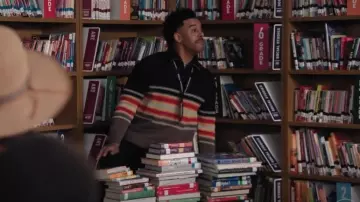 Craig Green Men's Tape Knit Polo in Black/Brown Multi worn by Tariq (Zack Fox) as seen in Abbott Elementary (S04E16)